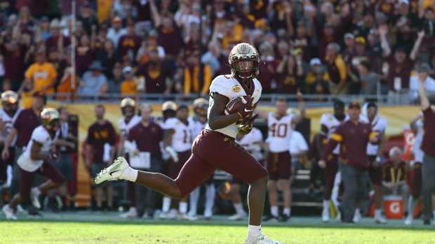 Jan 1, 2020; Tampa, Florida, USA; Minnesota Golden Gophers wide receiver Tyler Johnson (6) carries the ball to score a touchdown against the Auburn Tigers during the second half at Raymond James Stadium.