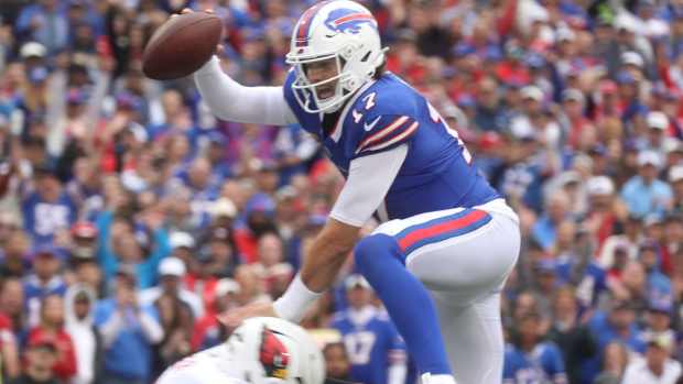 Bills quarterback Josh Allen jumps over an Arizona defender to score a touchdown at Highmark Stadium on September 8, 2024