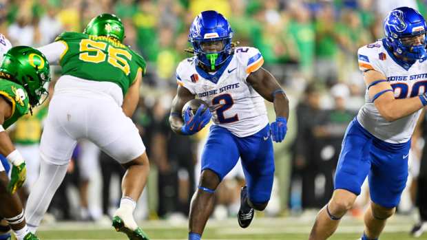 Sep 7, 2024; Eugene, Oregon, USA; Boise State Broncos running back Ashton Jeanty (2) picks up a first down during the second half against Oregon Ducks defensive lineman Derrick Harmon (55) at Autzen Stadium.