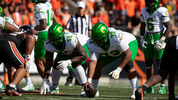 Titans of the Trenches: Iapani Laloulu and Marcus Harper II take their stance against Oregon State. Laloulu said a commitment to the basics fueled a standout performance in Corvallis.