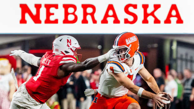 Sep 20, 2024; Lincoln, Nebraska, USA; Nebraska Cornhuskers defensive lineman Jimari Butler (1) grabs the face mask of Illinois Fighting Illini quarterback Luke Altmyer (9) during the second quarter at Memorial Stadium.