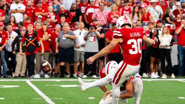 Sep 7, 2024; Lincoln, Nebraska, USA; Nebraska Cornhuskers place kicker Tristan Alvano (30) kicks a PAT against the Colorado Buffaloes during the second quarter at Memorial Stadium.