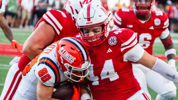 Sep 20, 2024; Lincoln, Nebraska, USA; Nebraska Cornhuskers defensive lineman Riley Van Poppel (44) hits Illinois Fighting Illini wide receiver Hank Beatty (80) on a punt return in the first quarter at Memorial Stadium.