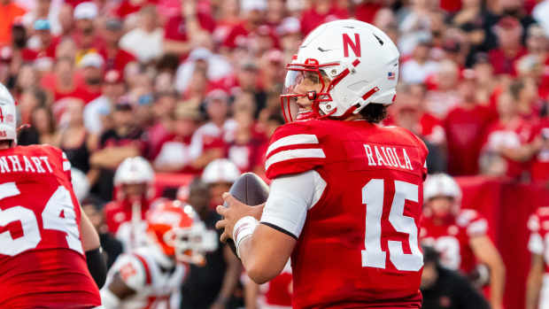 Sep 20, 2024; Lincoln, Nebraska, USA; Nebraska Cornhuskers quarterback Dylan Raiola (15) drops to throw against the Illinois Fighting Illini during the first quarter at Memorial Stadium.