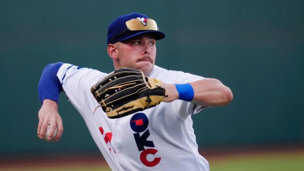 Oklahoma City's Dalton Rushing (21) throws to second during a baseball game between the Oklahoma City Baseball Club and the Round Rock Express at the Chickasaw Bricktown Ballpark in Oklahoma City, Wednesday, Aug. 7, 2024.