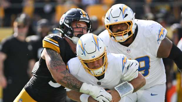 Sep 22, 2024; Pittsburgh, Pennsylvania, USA; Pittsburgh Steelers linebacker Nick Herbig (51) sacks Los Angeles Chargers quarterback Taylor Heinicke (8) during the third quarter at Acrisure Stadium.