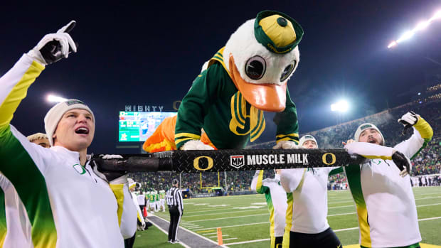 Nov 19, 2022; Eugene, Oregon, USA; Oregon Ducks mascot Puddles does push ups after an Oregon touchdown during the second half against the Utah Utes at Autzen Stadium. The Ducks won the game 20-17. Mandatory Credit: Troy Wayrynen-USA TODAY Sports  