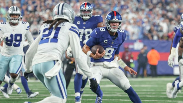 Sep 10, 2023; East Rutherford, New Jersey, USA; New York Giants quarterback Daniel Jones (8) carries the ball as Dallas Cowboys cornerback Stephon Gilmore (21) pursues during the first quarter at MetLife Stadium.