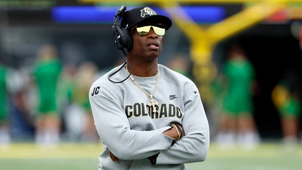 Sep 23, 2023; Eugene, Oregon, USA; Colorado Buffaloes head coach Deion Sanders watches the reply board during the first half against the Oregon Ducks at Autzen Stadium. Mandatory Credit: Soobum Im-USA TODAY Sports  