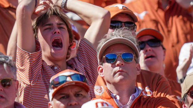 Texas Longhorns fans react to the game-winning touchdown from Oklahoma Sooners late in the fourth quarter during an NCAA college football game at the Cotton Bowl on Saturday, Oct. 7, 2023, in Dallas, Texas. This game makes up the 119th rivalry match-up. Oklahoma Sooners beat Texas Longhorns 34-30.