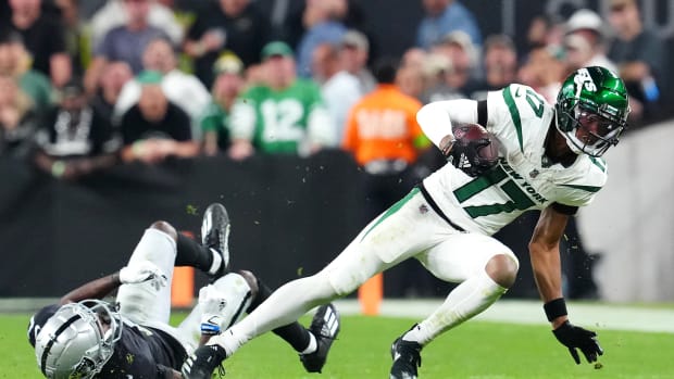 Jets' WR Garrett Wilson spins out of a tackle against the Raiders