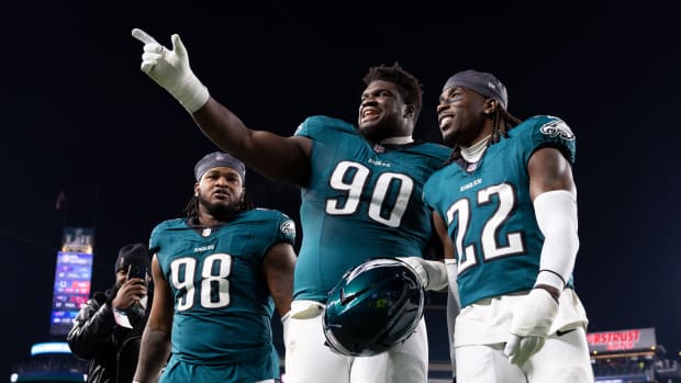 Philadelphia Eagles defensive tackle Jalen Carter (98) and defensive tackle Jordan Davis (90) and cornerback Kelee Ringo (22)