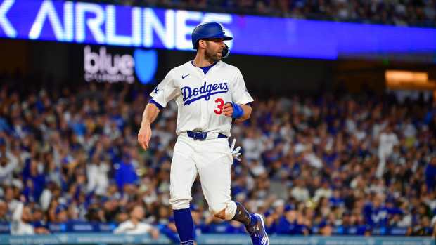 May 13, 2025; Los Angeles, California, USA; Los Angeles Dodgers outfielder Chris Taylor (3) scores a run in the third inning against the Oakland Athletics at Dodger Stadium.