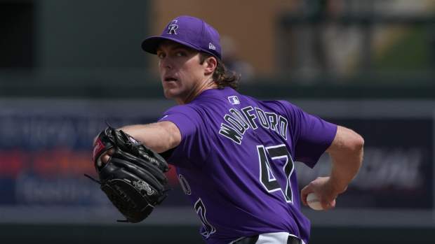 Colorado Rockies pitcher Jake Woodford throws against the San Diego Padres in the first inning at Salt River Fields at Talking Stick.