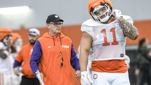 Clemson defensive coordinator Tom Allen near defensive lineman Peter Woods (11) during the football practice at the Allen N. Reeves Football Complex at Clemson University