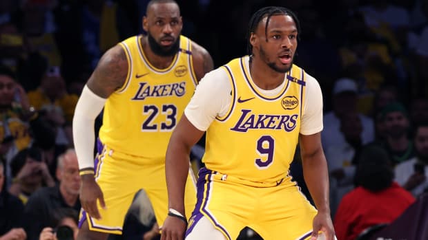 LeBron James and Bronny James of the Los Angeles Lakers defend during their game against the Minnesota Timberwolves at Crypto.com Arena on October 22, 2024.