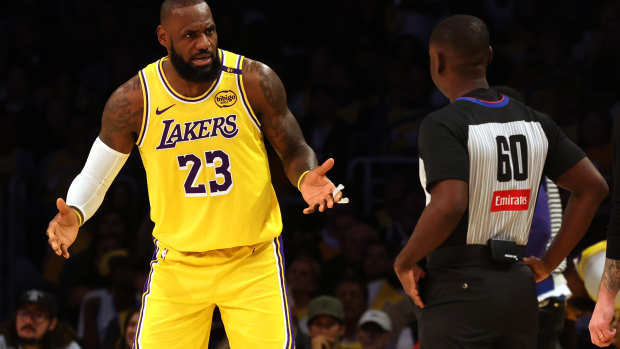 LeBron James of the Los Angeles Lakers and NBA referee James Williams