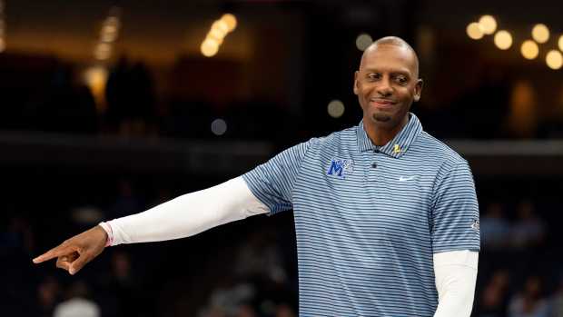 Memphis' head coach Penny Hardaway points towards the court as he speaks to his assistant coaches on the bench during the game between UNC and Memphis in the Hoops for St. Jude Tip-Off Classic at FedExForum.