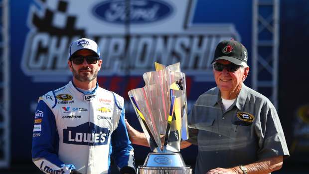 Nov 20, 2016; Homestead, FL, USA; NASCAR Sprint Cup Series driver Jimmie Johnson (left) greets former driver and Hall of Fame member Bobby Allison during the Ford Ecoboost 400 at Homestead-Miami Speedway. Mandatory Credit: Mark J. Rebilas-Imagn Images  