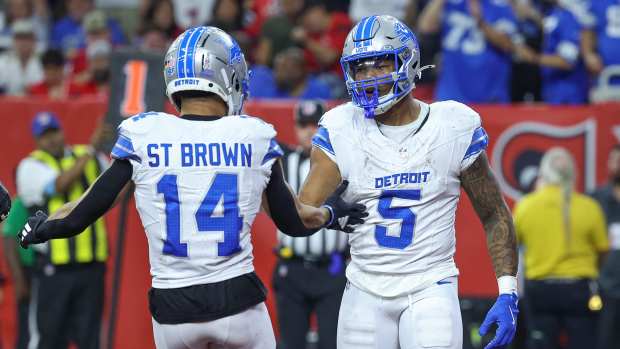 Nov 10, 2024; Houston, Texas, USA; Detroit Lions running back David Montgomery (5) celebrates with wide receiver Amon-Ra St. Brown (14) after scoring a touchdown during the third quarter against the Houston Texans at NRG Stadium.