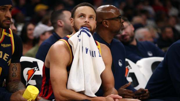 Dec 19, 2024; Memphis, Tennessee, USA; Golden State Warriors guard Stephen Curry (30) looks on from the bench during the second quarter against the Memphis Grizzlies at FedExForum. Mandatory Credit: Petre Thomas-Imagn Images