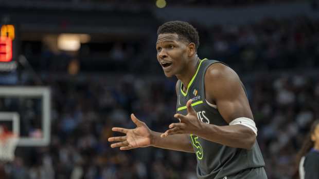 Minnesota Timberwolves guard Anthony Edwards reacts to a call by the referee.