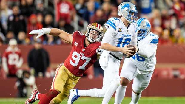 Nick Bosa chases down Lions quarterback Jared Goff.