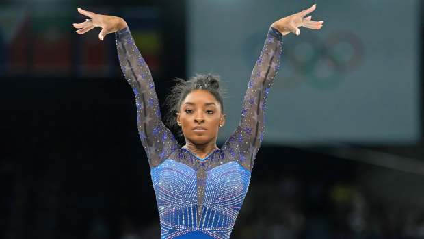 Simone Biles of the United States competes on the beam in the women's gymnastics all-around during the Paris 2024 Olympic Summer Games.