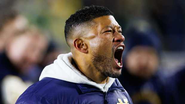 Notre Dame head coach Marcus Freeman celebrates after winning the first round of the College Football Playoff 27-17 against Indiana at Notre Dame Stadium on Friday, Dec. 20, 2024, in South Bend.