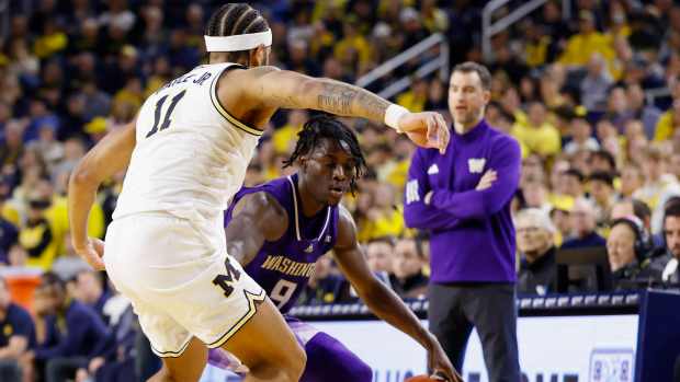 Jan 12, 2025; Ann Arbor, Michigan, USA; Washington Huskies guard Zoom Diallo (9) dribbles on Michigan Wolverines guard Roddy Gayle Jr. (11) in the second half at Crisler Center.