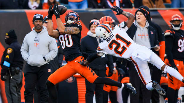 Dec 22, 2024; Cincinnati, Ohio, USA; Cincinnati Bengals wide receiver Andrei Iosivas (80) catches a pass against Cleveland Browns cornerback Denzel Ward (21) in the second half at Paycor Stadium.