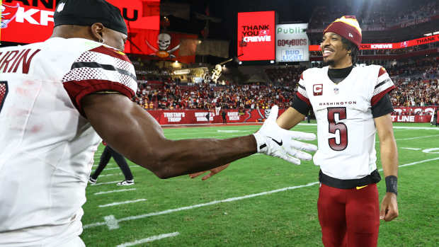 Jayden Daniels celebrates with Terry McLaurin after the Commanders' win at Tampa Bay.