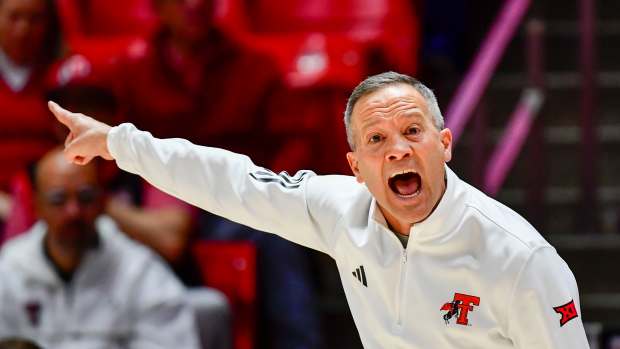 Jan 4, 2025; Salt Lake City, Utah, USA; Texas Tech Red Raiders head coach Grant McCasland makes a call during the second half against the Utah Utes at the Jon M. Huntsman Center.