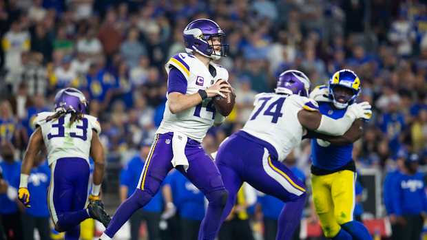 Jan 13, 2025; Glendale, AZ, USA; Minnesota Vikings quarterback Sam Darnold (14) against the Los Angeles Rams during an NFC wild card game at State Farm Stadium. 