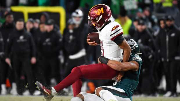 Philadelphia Eagles linebacker Nolan Smith Jr. (3) sacks Washington Commanders quarterback Jayden Daniels (5).