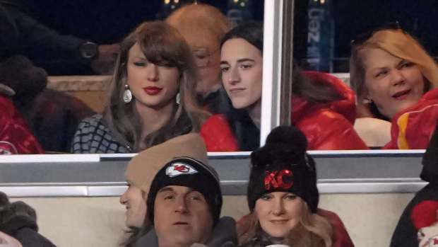 Recording artist Taylor Swift sits with Indiana Fever guard Caitlin Clark during the AFC divisional round at Arrowhead Stadium.