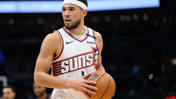 Jan 16, 2025; Washington, District of Columbia, USA; Phoenix Suns guard Devin Booker (1) looks on during the third quarter against the Washington Wizards at Capital One Arena. Mandatory Credit: Reggie Hildred-Imagn Images