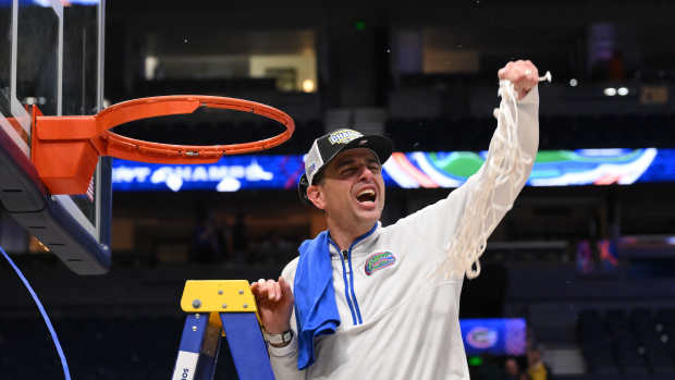 Florida Gators head coach Todd Golden cuts the net after winning the 2025 SEC Championship Game.