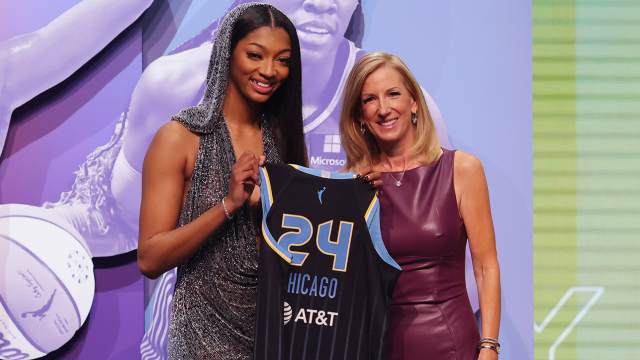 Angel Reese holds a Chicago Sky jersey alongside WNBA commissioner Cathy Engelbert after Reese was selected with the No. 7 pick in the 2024 WNBA draft in Brooklyn on April 15, 2024