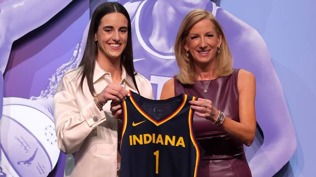 Caitlin Clark and WNBA commissioner Cathy Engelbert hold an Indiana Fever jersey after Clark was selected No. 1 overall in the 2024 WNBA draft.