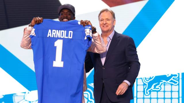 Terrion Arnold, a cornerback from the University of Alabama, shows off his Detroit Lions jersey with NFL commissioner Roger Goodell after he was picked in the first round of the 2024 NFL draft at the NFL draft theater in Detroit on Thursday, April 25, 2024.