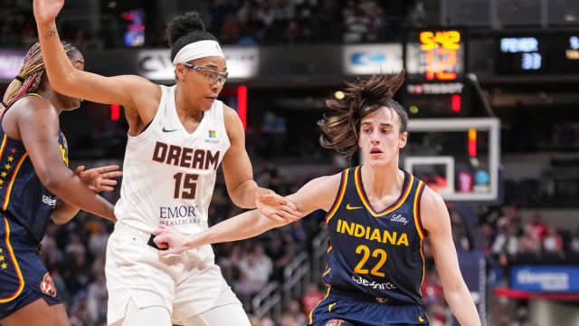 Indiana Fever guard Caitlin Clark (22) rushes up the court against Atlanta Dream guard Allisha Gray (15) on Thursday, May 9, 2024, during the preseason game against the Atlanta Dream at Gainbridge Fieldhouse in Indianapolis.  