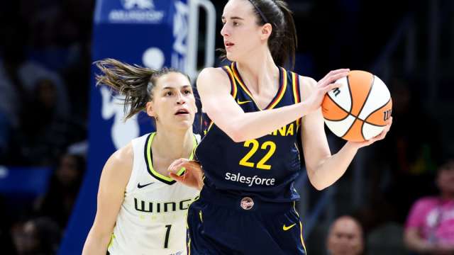 Indiana Fever guard Caitlin Clark (22) controls the ball as Dallas Wings guard Ashley Joens (1) defends during the second half at College Park Center. 