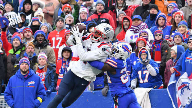 New England Patriots wide receiver DeVante Parker (1) catches a touchdown over the defense of Buffalo Bills cornerback Kaiir Elam (24) in the fourth quarter at Highmark Stadium