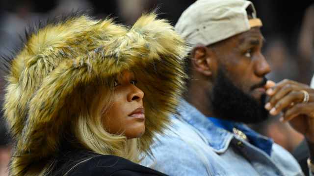 May 13, 2024; Cleveland, Ohio, USA; Los Angeles Lakers forward LeBron James and his wife Savannah James watch the game in the second quarter of game four of the second round for the 2024 NBA playoffs between the Cleveland Cavaliers and the Boston Celtics at Rocket Mortgage FieldHouse.