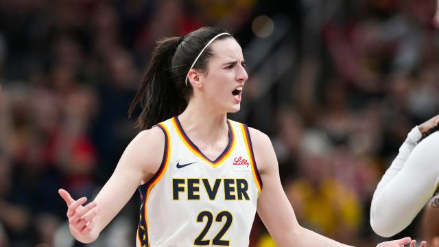 Indiana Fever guard Caitlin Clark (22) talks to Seattle Storm guard Victoria Vivians (35) following being run into after making a three-pointer, Thursday, May 30, 2024, during the WNBA game at Gainbridge Fieldhouse in Indianapolis. 