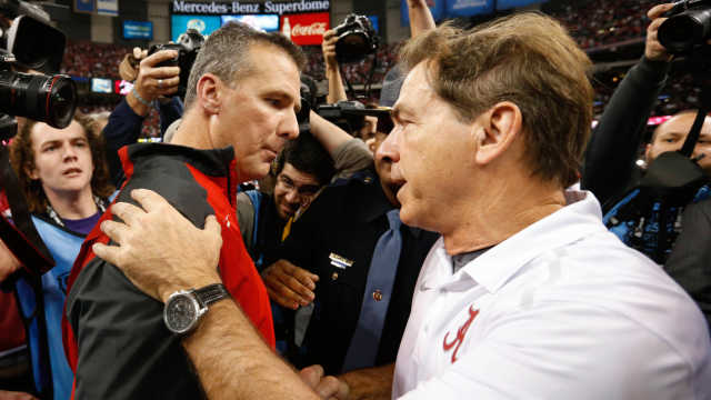 Ohio State coach Urban Meyer and Alabama coach Nick Saban speak after the Buckeyes’ win at the 2015 Sugar Bowl.