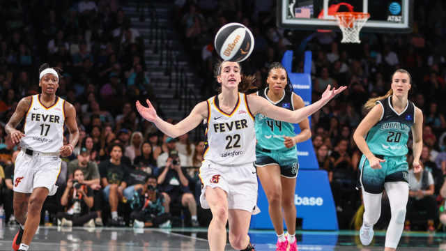 Indiana Fever guard Caitlin Clark (22) reacts after making a pass in the second quarter against the New York Liberty at Barclays Center.