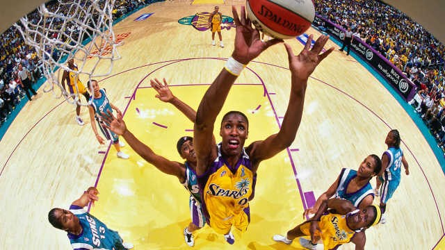 Lisa Leslie #9 of the Los Angeles Sparks grabs a rebound during Game 2 of the 2001 WNBA Finals on September 1, 2001, at Staples Center in Los Angeles, California.