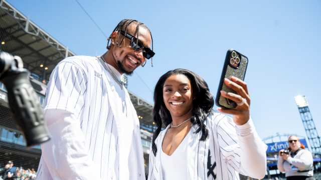 Chicago Bears safety Jonathan Owens and American gymnast Simone Biles at a White Sox game on April 13, 2024.